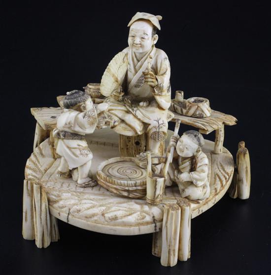 A Japanese ivory okimono of a man and two boys, signed Shomi, Meiji period 13cm, some faults
